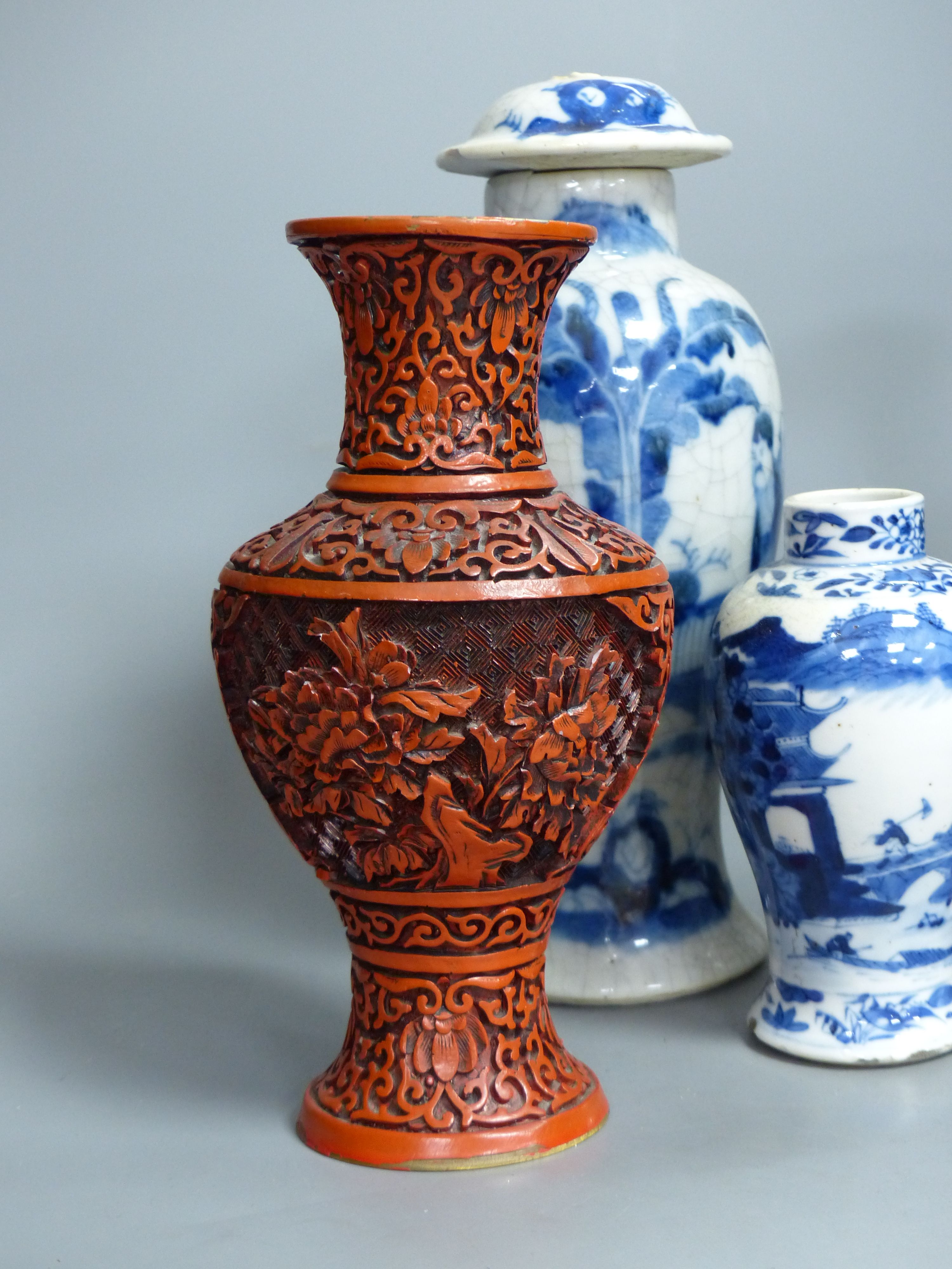 Three Chinese blue and white vases, a cloisonne enamel vase, another vase and a soapstone figure